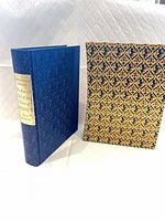 Hardcover book standing next to matching slipcase