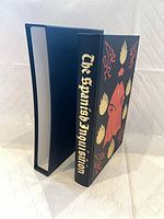 Book in illustrated cloth binding inside matching slipcase