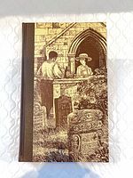 Front cover showing illustrated boards and cloth spine