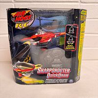 Front of boxed Air Hogs Sharpshooter Quick Draw helicopter set