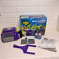 Full set showing oven, accessories, box, molds, tools, goop bottles, instructions