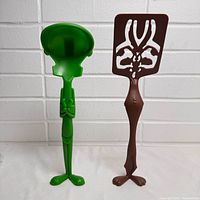 Front view of both utensils standing upright