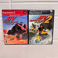 Front view of both PS2 game cases
