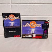 Front view of ActRaiser SNES box and instruction booklet