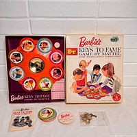 Box lid, open game with spinner board and components displayed