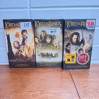 Front view of all three sealed VHS tapes