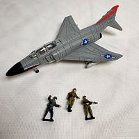 Top view of jet with three soldier figures