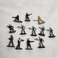 All twelve Micro Machines Star Wars figures on cloth background