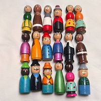Front view of 20 wooden Little People figures arranged in grid
