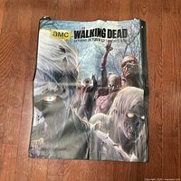 Front view of oversized AMC The Walking Dead promotional bag showing graphic and zipper