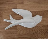 Top view of white ceramic swallow showing full shape