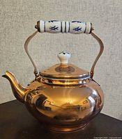 Front view of copper tea kettle with lid closed