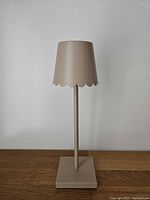 Full view of lamp front, shade and base visible