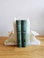 Front view showing pair holding books