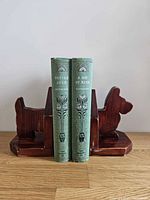Front view showing pair of Scottie dog bookends holding books