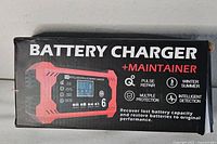 Front of retail box showing product name, digital display image and feature icons