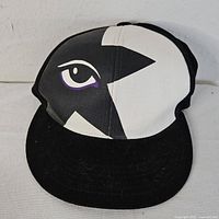 Front view of KISS snapback hat showing eye graphic and bill