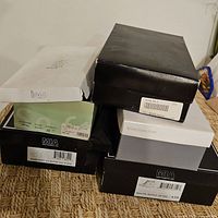 Stack of six shoe boxes showing brands Nickels, Worthington, MIA and others