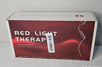 Front of sealed red light therapy device box