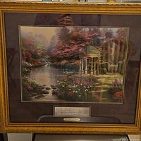 Full view of framed Thomas Kinkade print in gold frame