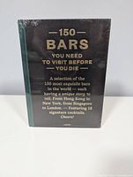 Front cover showing sealed book with title and publisher