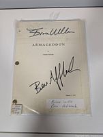 Full view of signed Armageddon script in sleeve