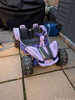 Full front and side view of purple Power Wheels Dune Extreme ride-on car
