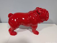 right side profile of red bulldog sculpture