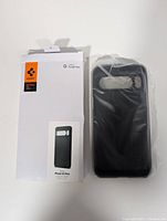 Case removed from box in plastic wrap beside packaging