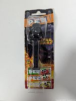 Front view of sealed Darth Vader PEZ dispenser package showing dispenser and candy packs