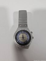 Front view of Swatch Irony Zebah showing dial and bezel