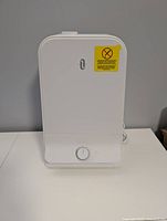 Front view of assembled humidifier showing logo and status sticker
