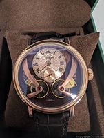 Front view of Earnshaw Beaufort Anatolia watch in display cushion showing dial, case, strap