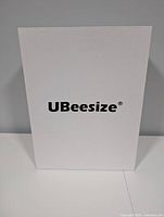 White retail box with UBeesize logo
