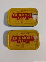 Top view of both yellow Erinmore Flake tins with lids on