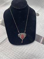 Necklace displayed on bust showing pendant detail