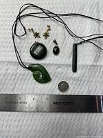 Overall view showing all pendants and earrings with measuring aids