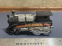 Left side view of Rail Rodder showing graphics and wheel detail with scale ruler