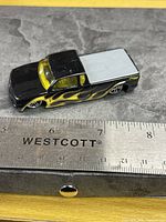 Side profile showing flame graphics and scale reference