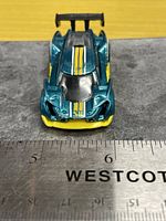 Front top view showing stripes, front detailing, ruler for scale