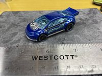 Top angled view showing entire car and ruler for scale