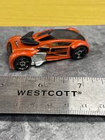 Left side view of Phantom Racer beside ruler showing length