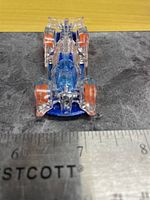 Top view of Hot Wheels Hi-Tech Missile showing overall condition and size against ruler