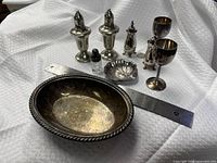 All eight items grouped: bowl, shakers, shell dish, goblets