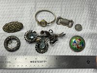 Group shot of all seven items with scale