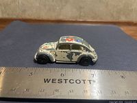 Side profile of Yatming Volkswagen Beetle beside ruler showing approx 3 in length