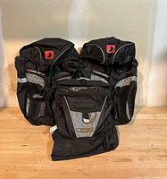 Front view of two Garneau Core 16 panniers and one Masque bag on tabletop