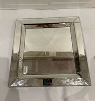 Square mirror showing full view with beveled mirrored frame