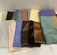 assorted folded fabrics displayed