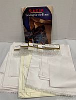 Book, fabric pieces, and ring packages together